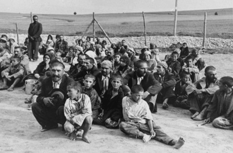A group of Gypsies wait to be gassed at the Belzec death camp