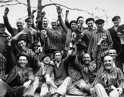 Dachau prisoners celebrate their liberation from Dachau by drinking wine